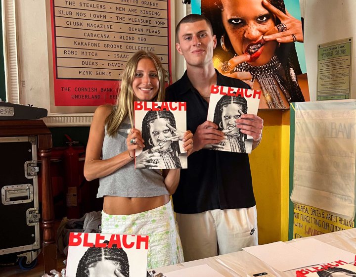 Montana Cooke and Alex Wilson holding their magazine entitled Bleach