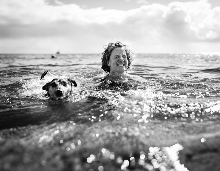 Jane Pugh swimming in the sea with her dog 