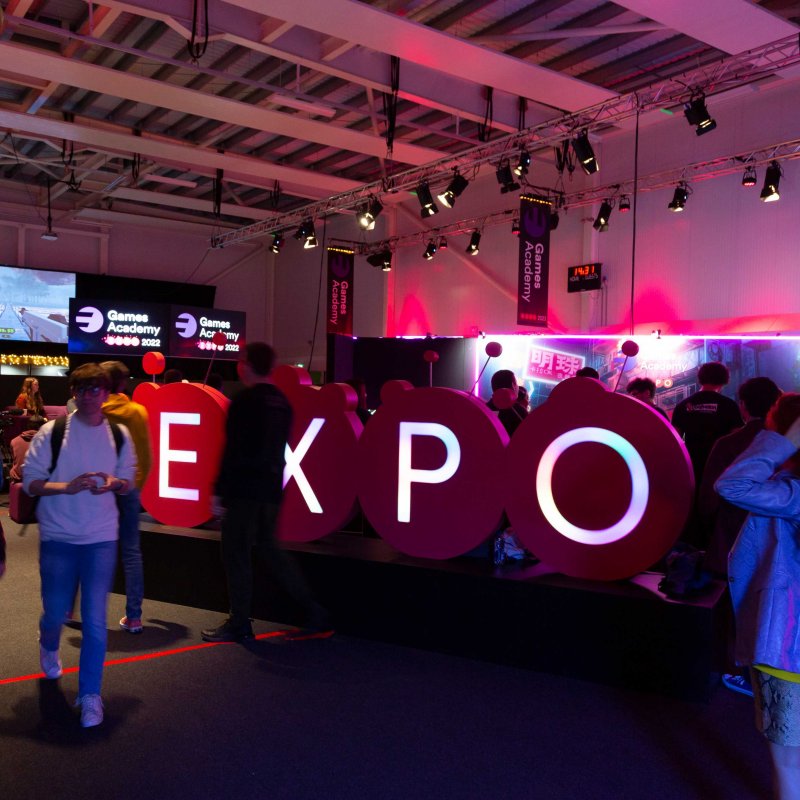 A large 'Expo' sign greets arrivals at the 2022 Games Expo